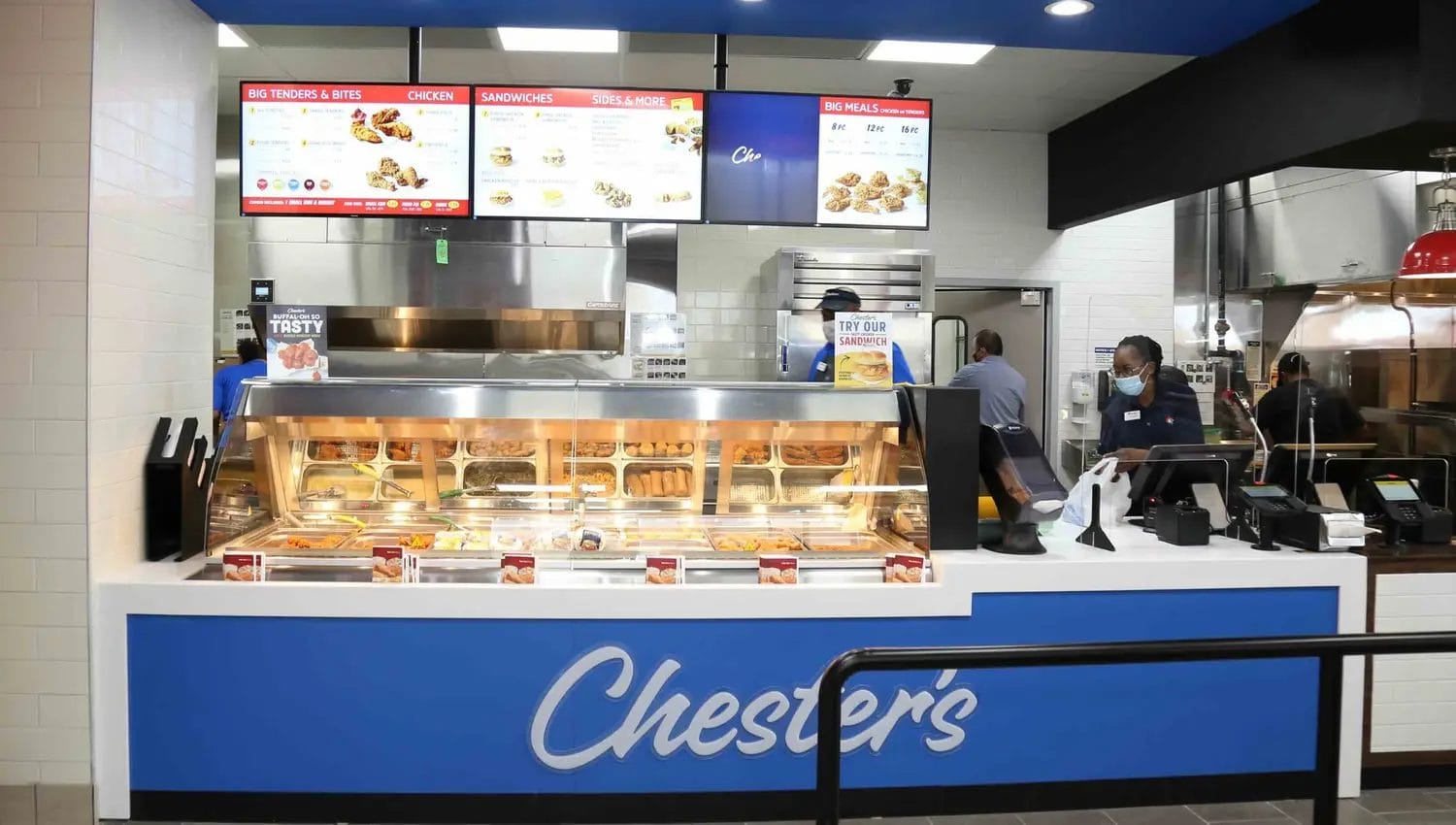 Fast food counter with menu displays.